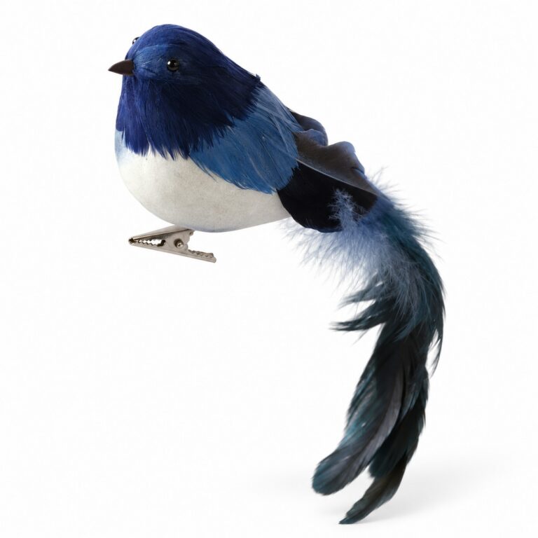 Blue bird Christmas ornament with a white belly, realistic feathers, long blue and black tail, and metal attachment clip