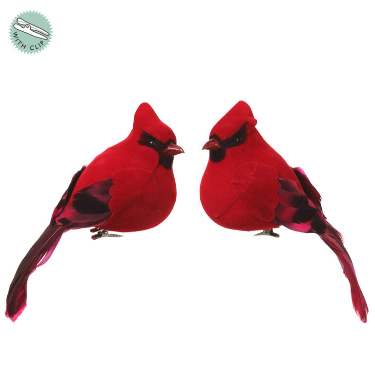 Two red cardinal bird ornaments with black facial markings, dark red feather wings, long tails, and metal attachment clips