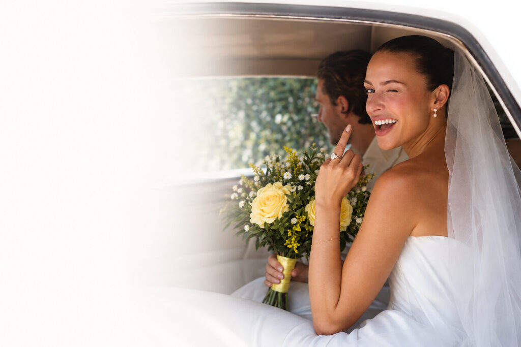 Bride holding a custom yellow and white wedding bouquet
